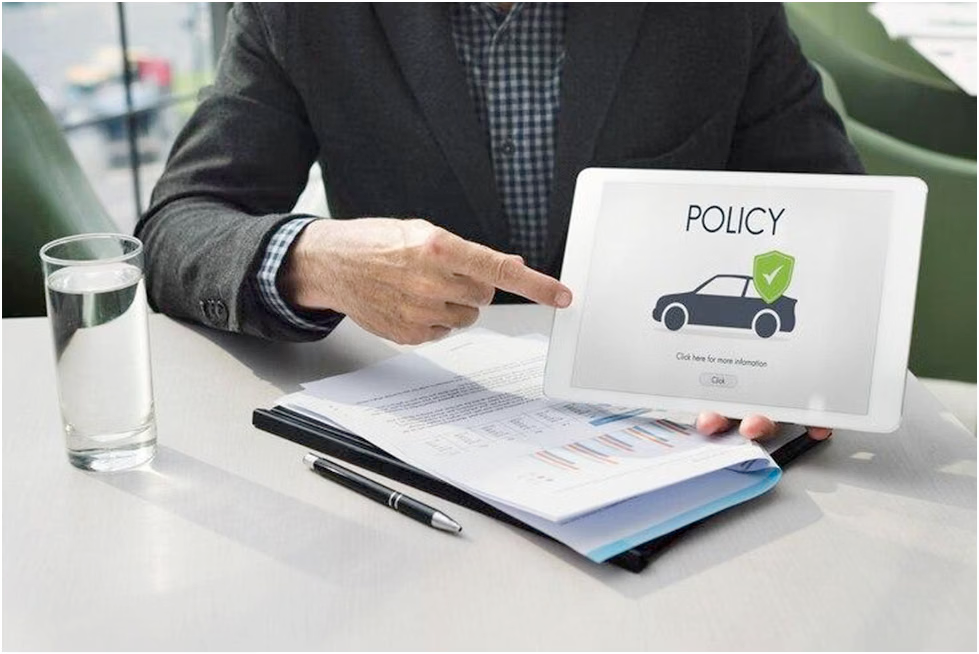 A business professional reviewing a car insurance document with confidence